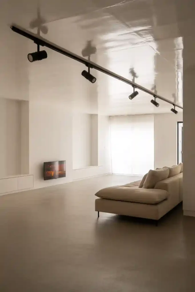 High-Gloss Ceiling + Strategic Spot Lighting